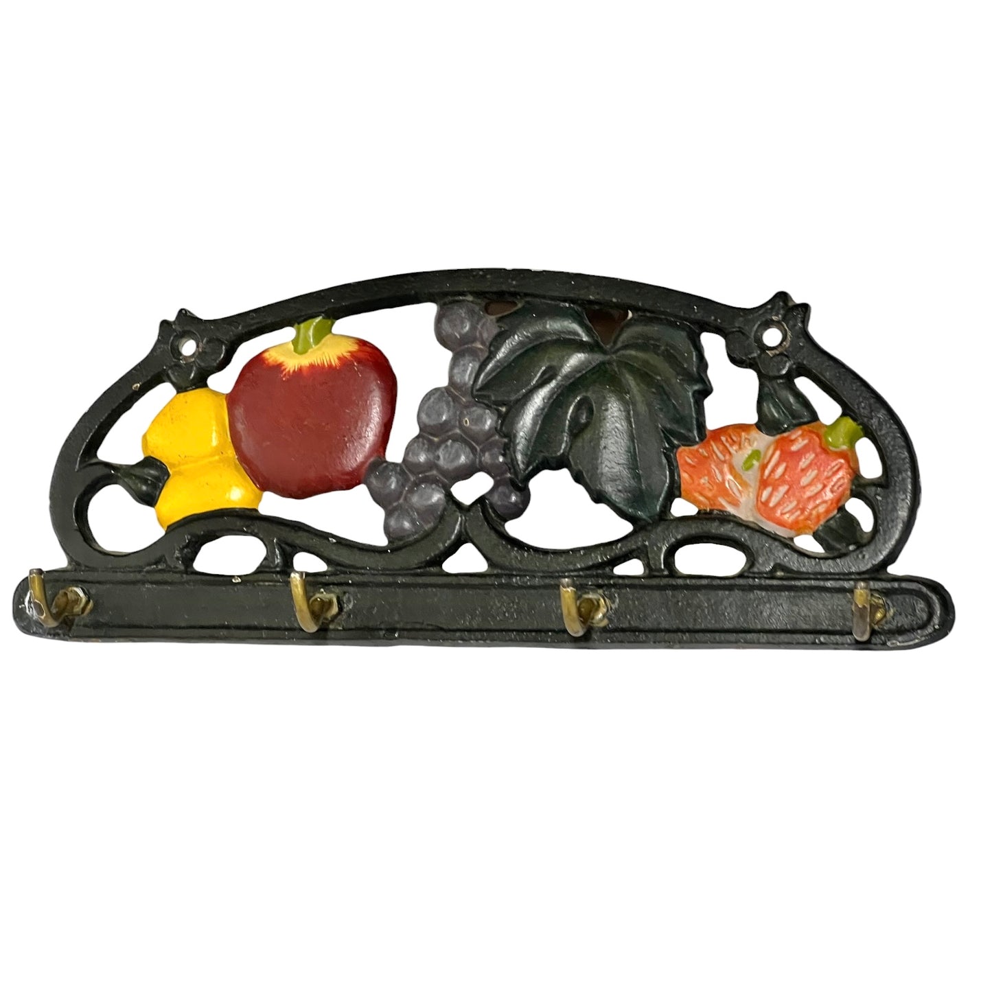 A vintage cast iron wall hook with a decorative fruit and grape design in red, yellow, orange, and gray, set against a plain white background.