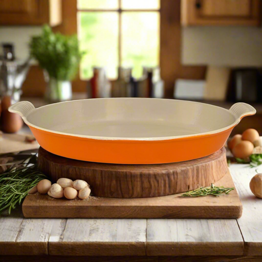Orange and beige ceramic baking dish on a wooden stand in a kitchen setting