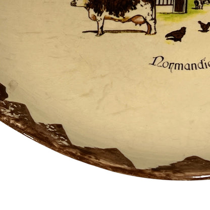 Map of Normandy with illustrations of cows and text on a beige background