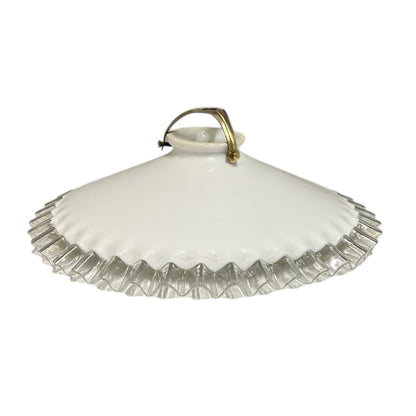 Vintage-style ceiling light fixture with white glass shade and brass fitting on a white background