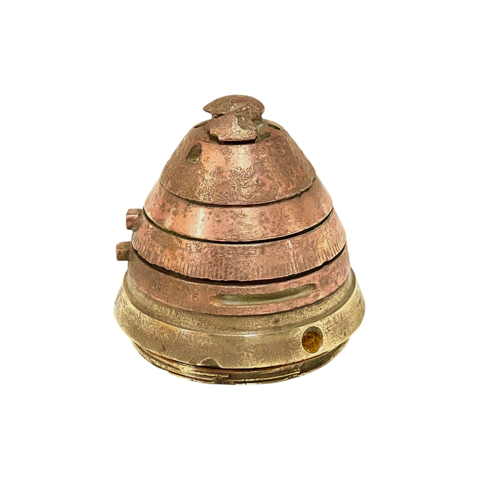 WW1 brass fuse paperweight on a white background