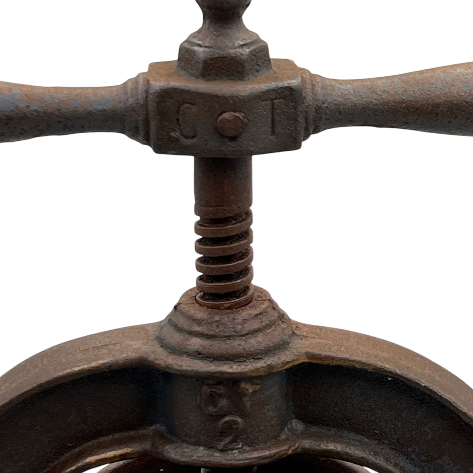 Close-up of a rusty metal lever mechanism of a fruit press on a white background
