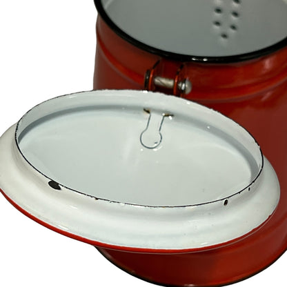 Close-up of a red teapot on a white background