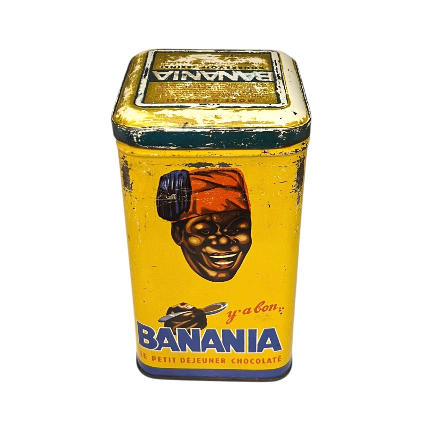 Vintage tin can with a colorful design featuring a face and 'Banania' branding on a white background.