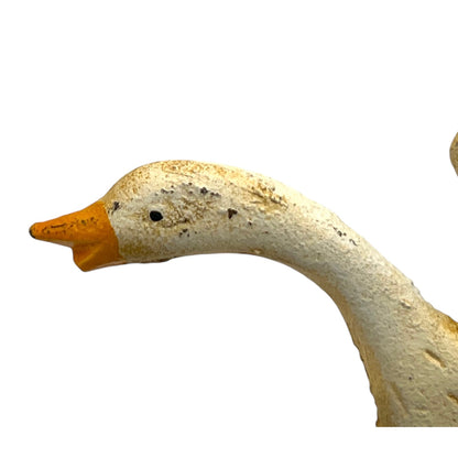 close up of toilet paper holder with a goose design on a white background
