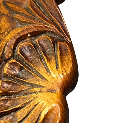 Close up of a raised 3d wood resin wall plaque of a French baker on a white background