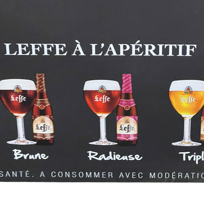 Advertisement for Leffe beer with various bottles and glasses on a black background