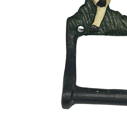 Close-up of a black cast iron or metal frame component with a textured top edge, a small circular hole, and a light beige loop or handle section at the upper right, shown on a plain white background.