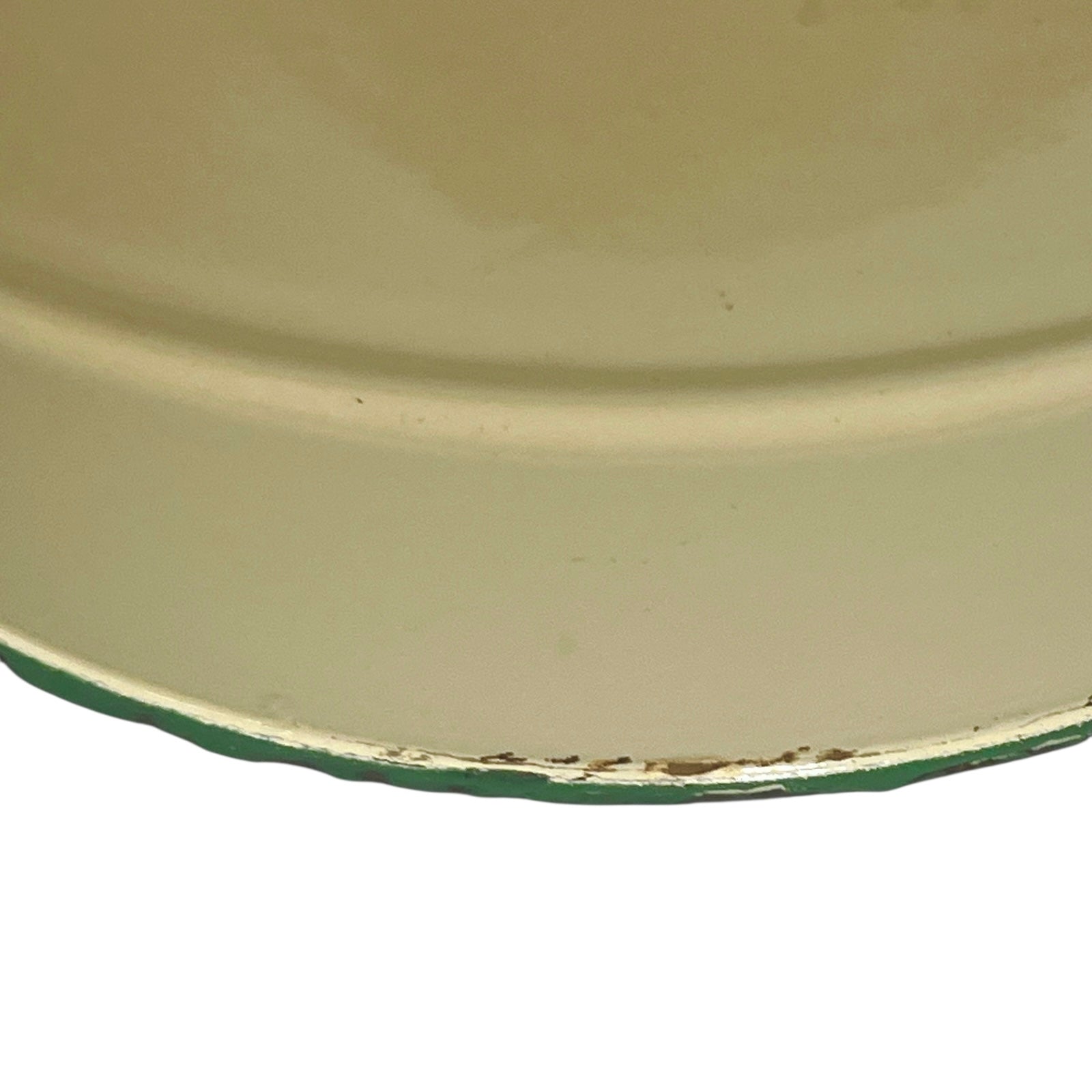 Close up of French vintage cream and green enamel bucket with a lid and handle on a white background