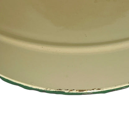 Close up of French vintage cream and green enamel bucket with a lid and handle on a white background