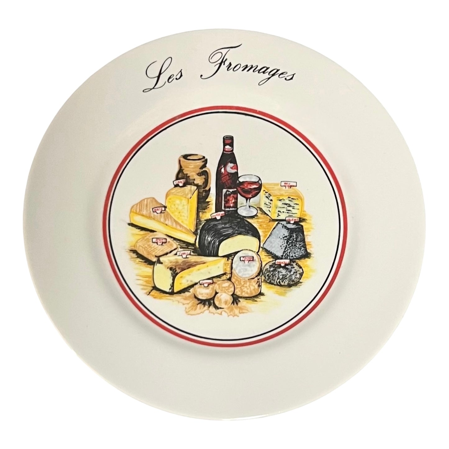 Decorative plate with illustrations of cheeses, wine, and other food items, featuring the text 'Les Fromages'.