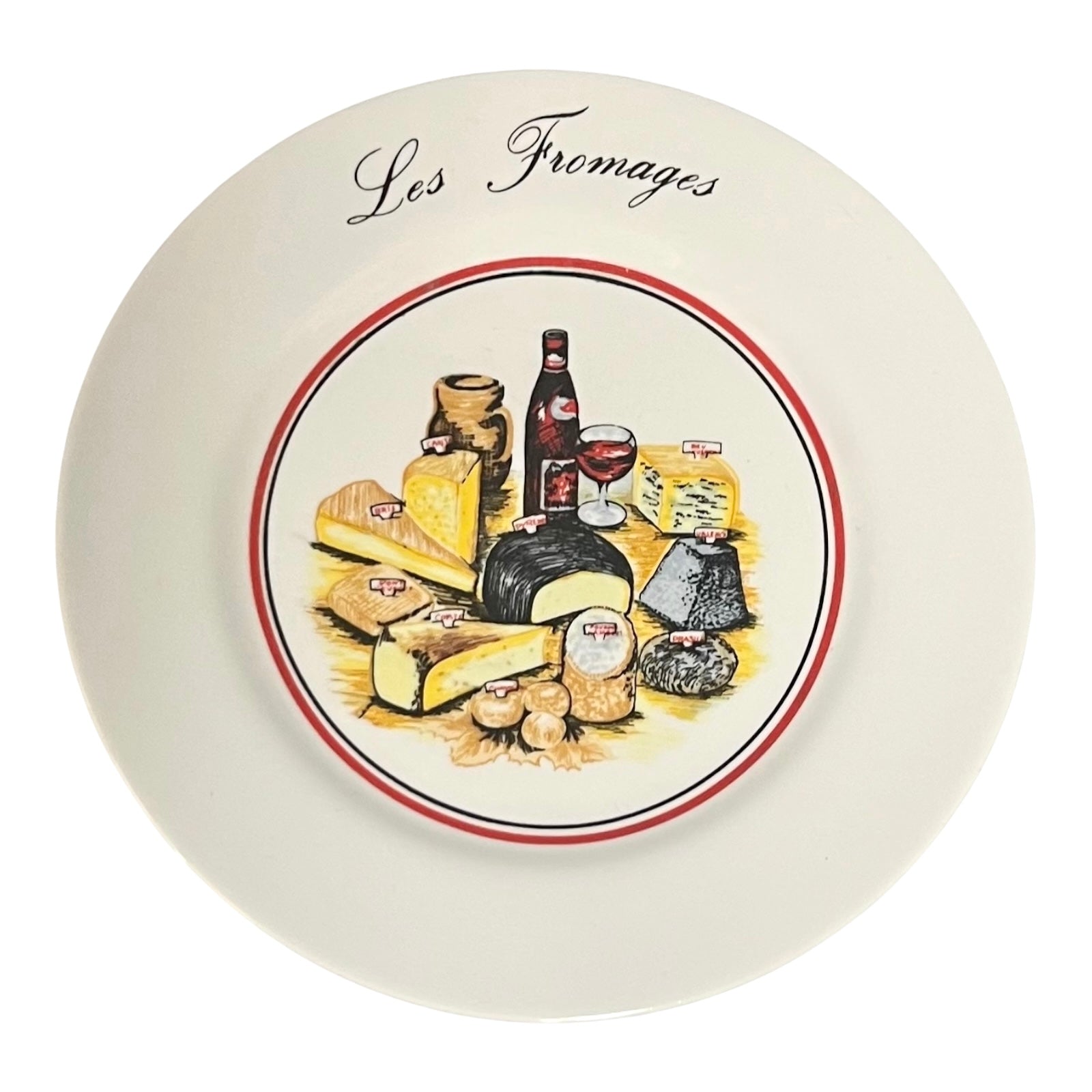Decorative plate with illustrations of cheeses, wine, and other food items, featuring the text 'Les Fromages'.