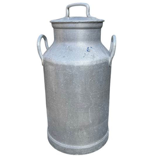 Vintage-style metal milk churn on a white background