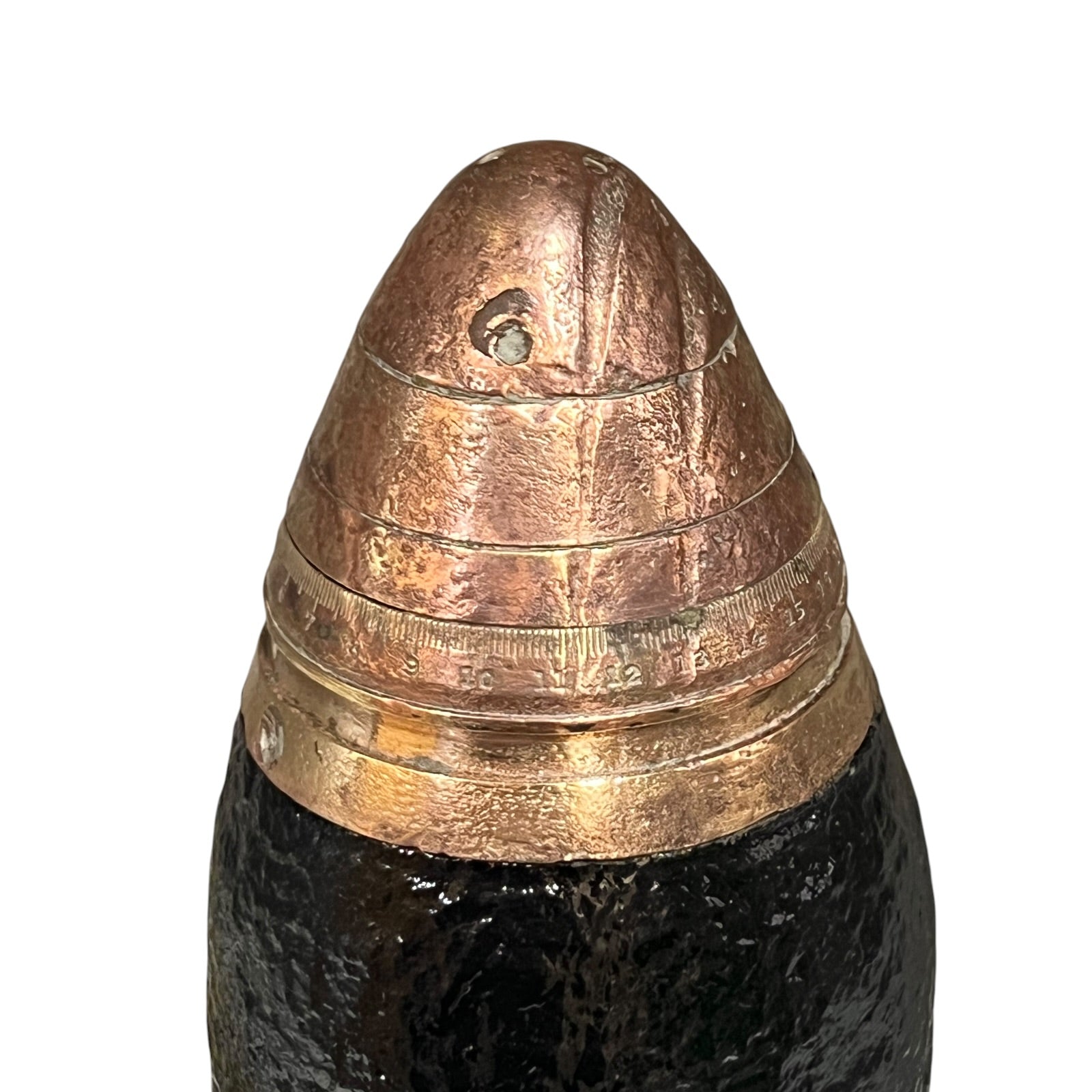 Brass fuse on a WW1 18 pounder on a white background 