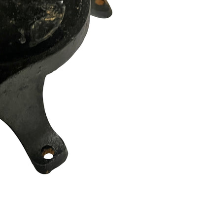 Close-up of a black metal clamp on a white background