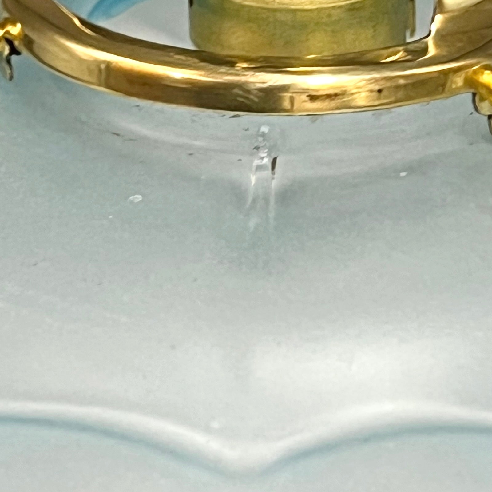 Close-up of the pendant shade rim and collar showing small vintage nibbles as described in the condition.