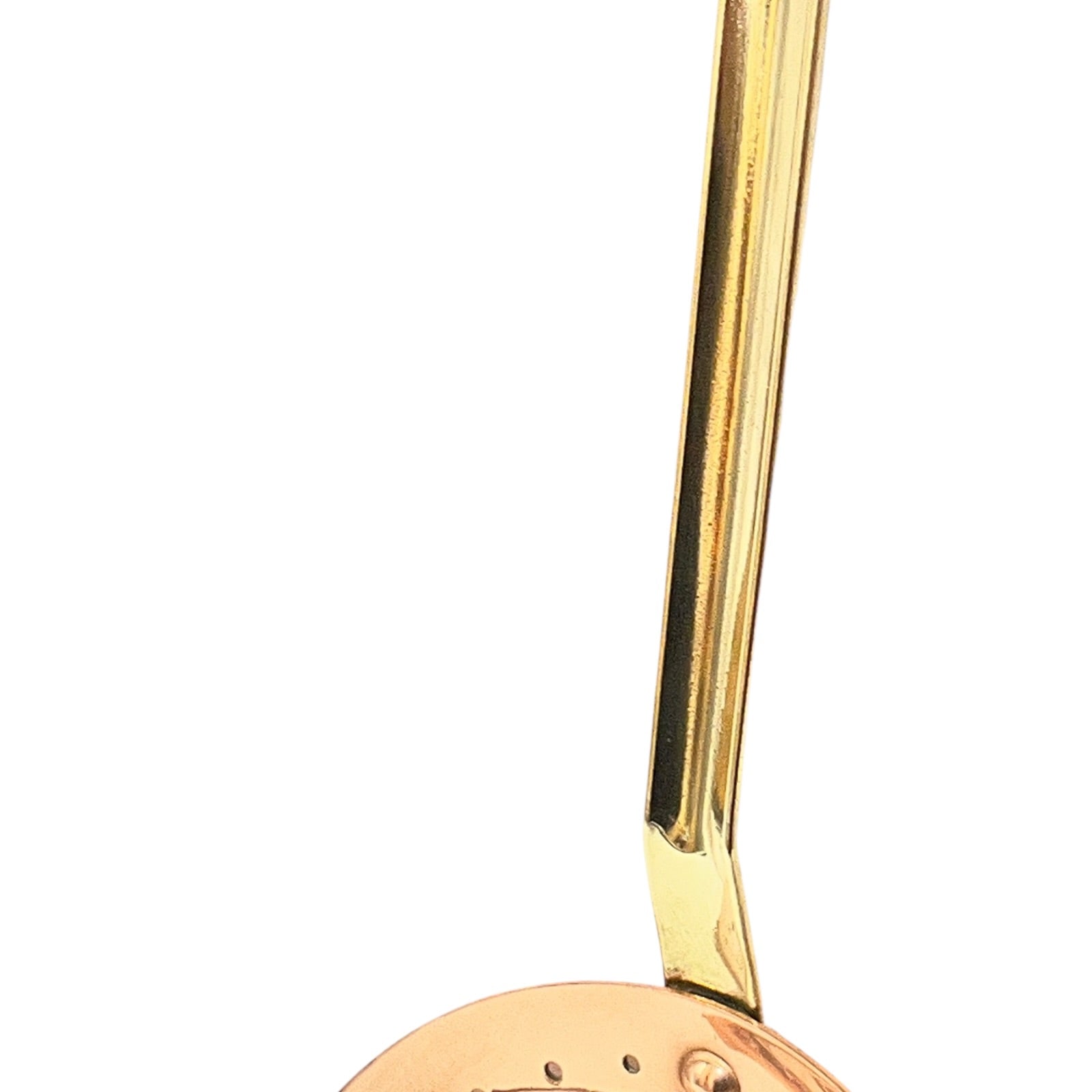 close up of brass spoon handle on a white background
