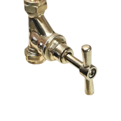 Brass faucet on a white background