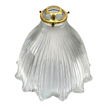 Clear ribbed glass pendant light with gold fixture on a white background
