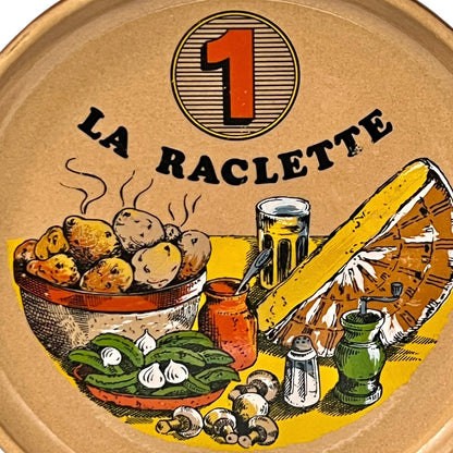Plate with 'La Raclette' branding, the number 1 and illustrations on a white background