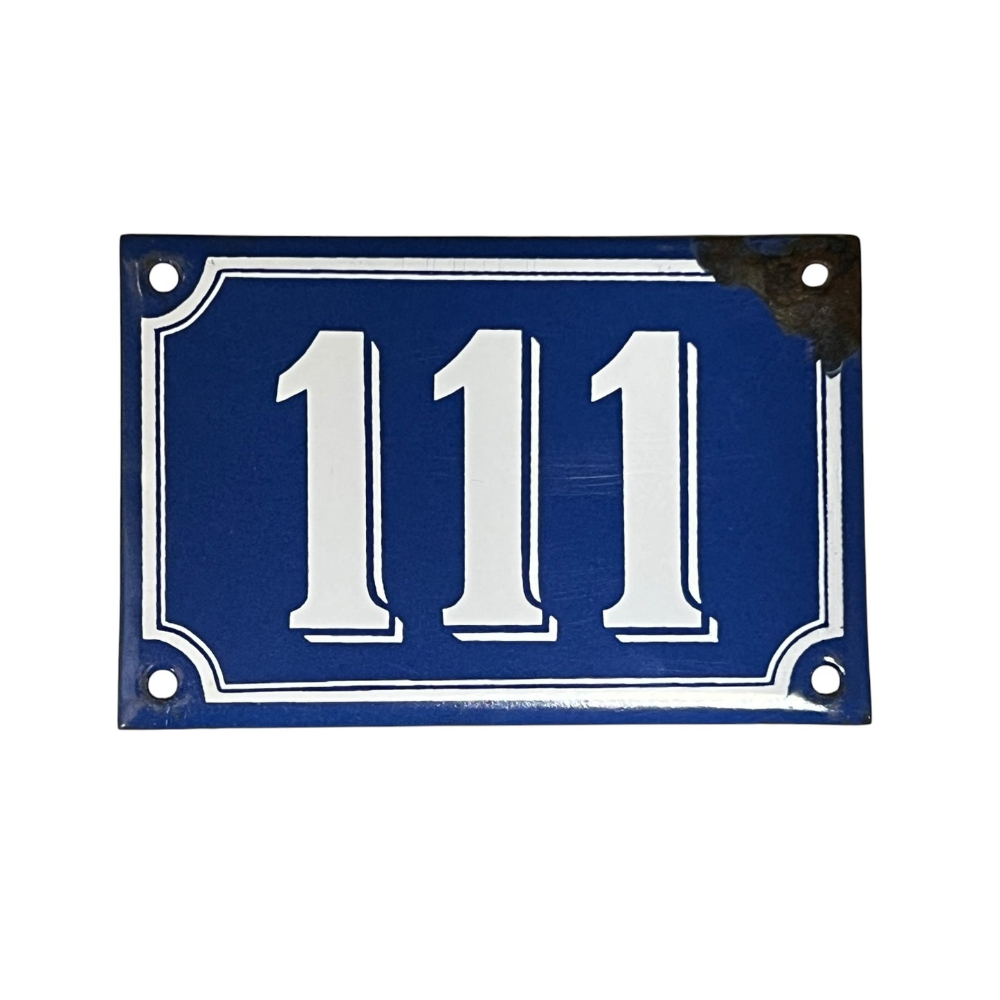 Vintage blue and white French enamel door number 111 ideal for a vintage home, set on a white background