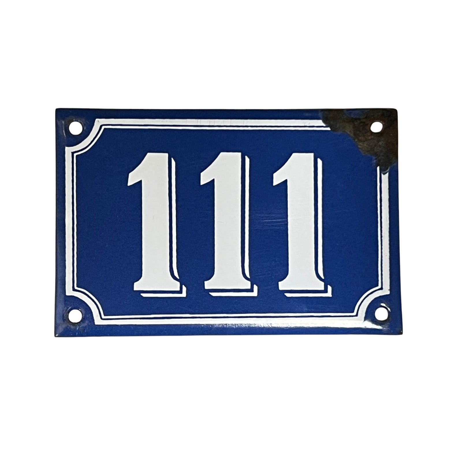 Vintage blue and white French enamel door number 111 ideal for a vintage home, set on a white background