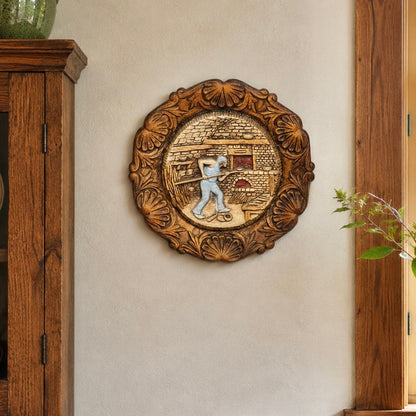 French vintage circular raised 3d wood resin wall plaque on a wall in a rustic kitchen with a wooden cabinet and a vase with greenery