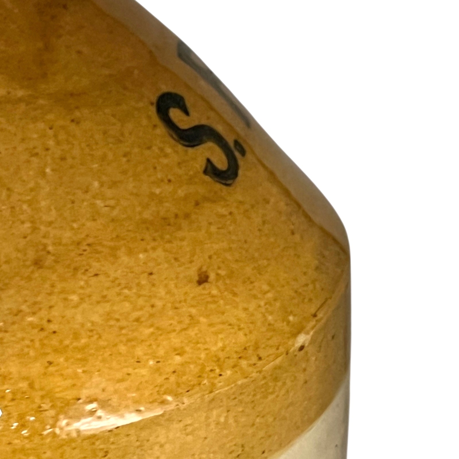 Close-up of a brown ceramic bowl with a logo on a white background