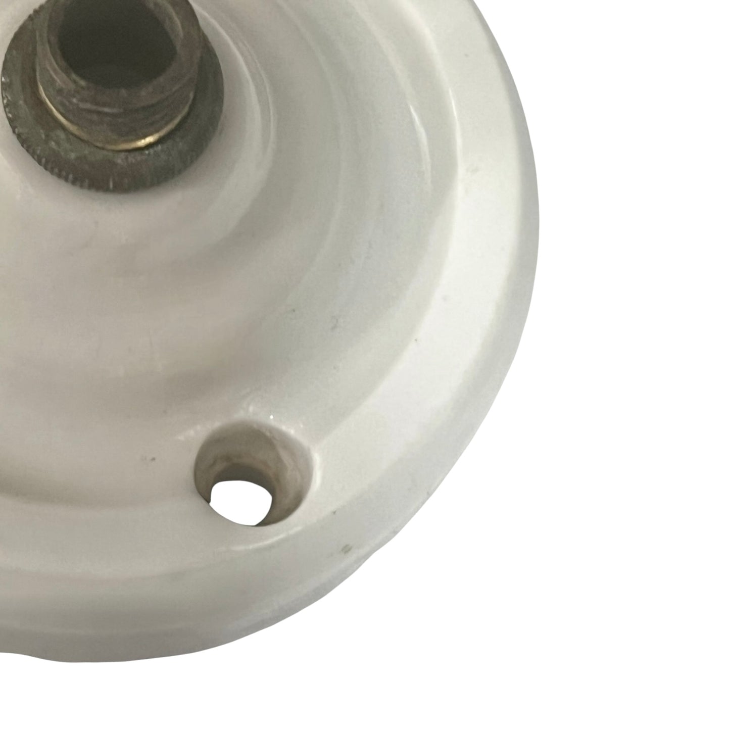 White French porcelain ceiling light rose fitting with a brass screw and 2 screw holes on a white background