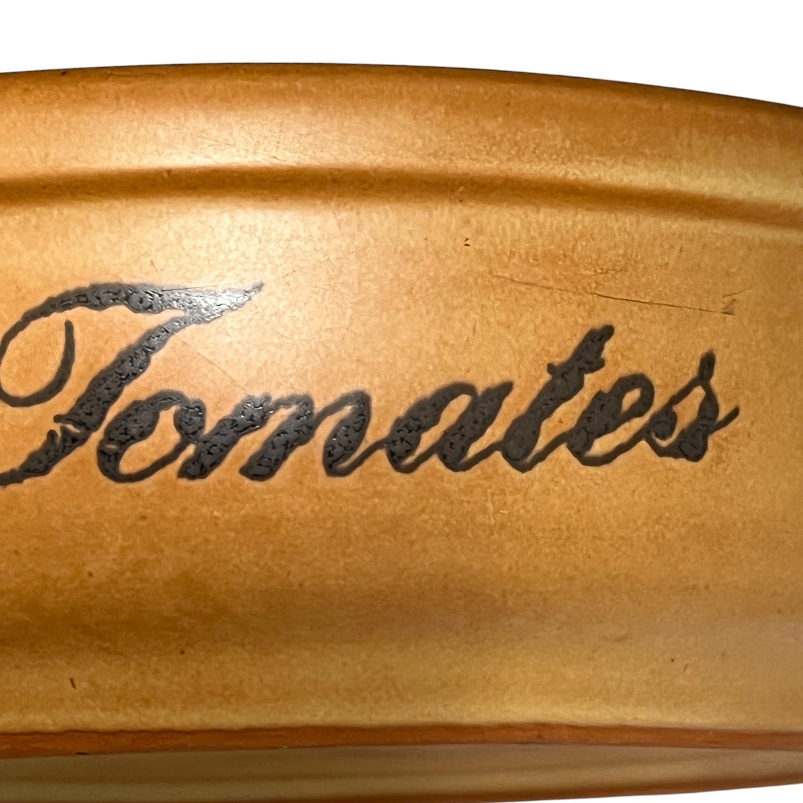 Stoneware  container with 'Tomates' engraved on a white background