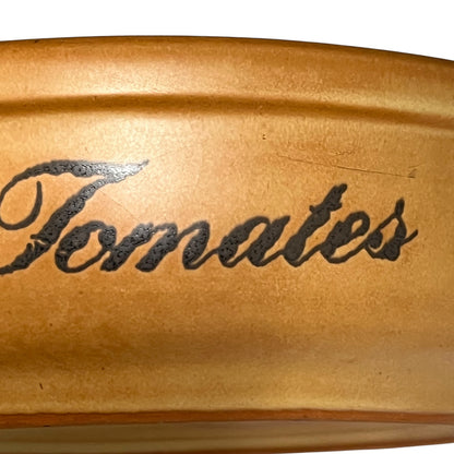 Stoneware  container with 'Tomates' engraved on a white background
