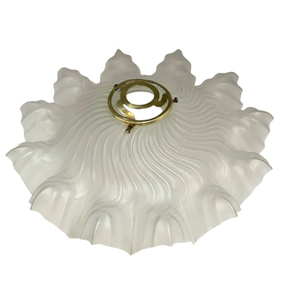 Close up of a glass lampshade on a white background 