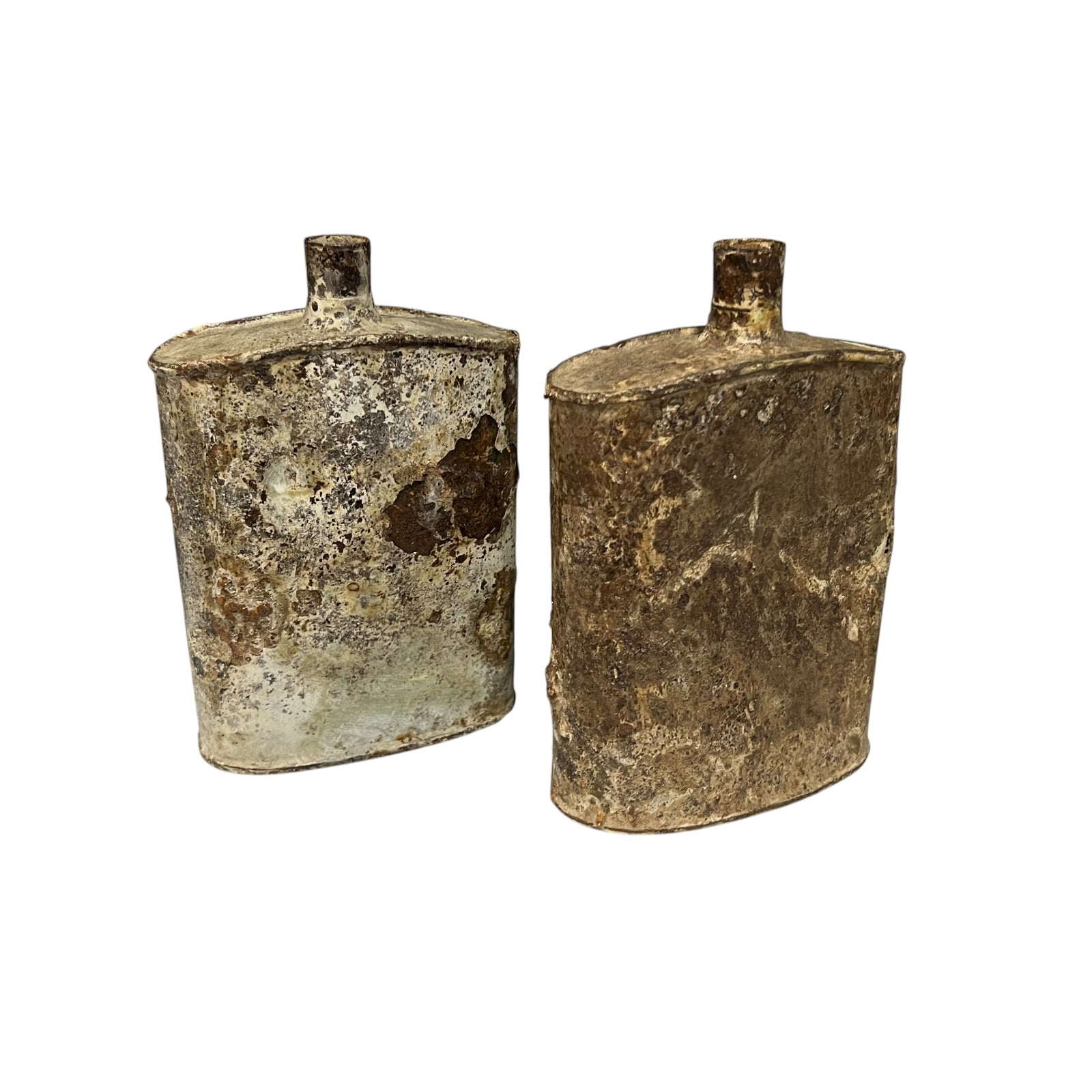 Pair of relic British WW1 metal water bottles in a rusty and flaky condition on a white background