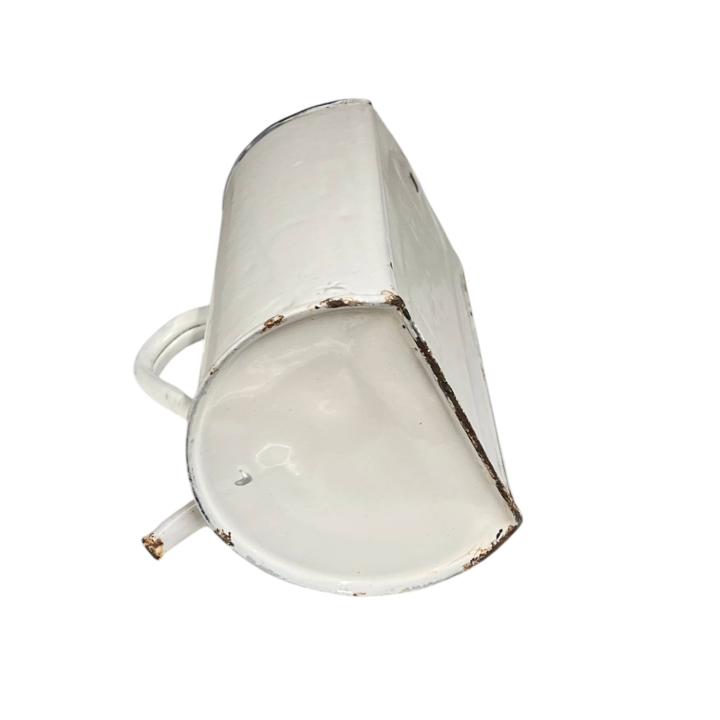 A vintage white enamel metal cup with a distressed finish showing brown rusted edges, isolated on a white background.