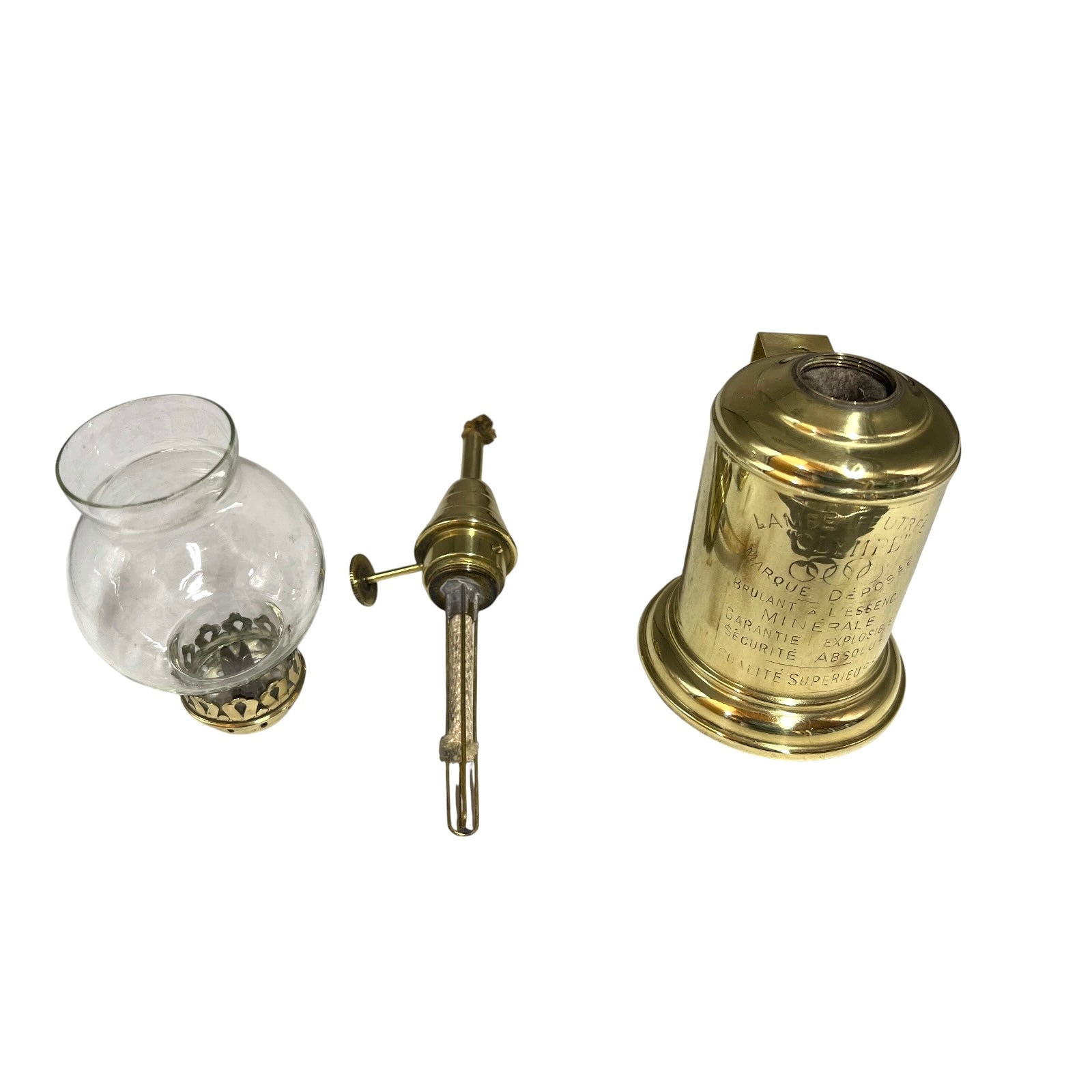Vintage brass oil lamp parts on a white background