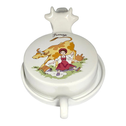 Vintage French L'Hirondelle porcelain cheese dish with cow-shaped white base and illustrated Fromage lid, traditional French farmhouse cheese server - top view