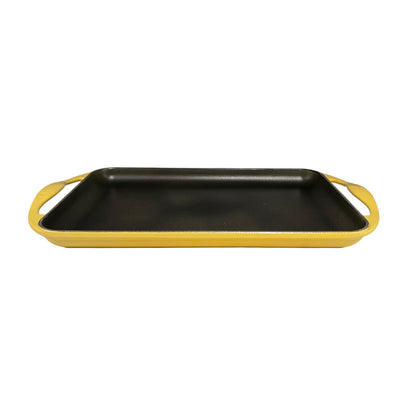 Le Cresuet griddle pan with yellow handles on a white background