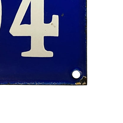 Blue sign with white number '4' on a white background