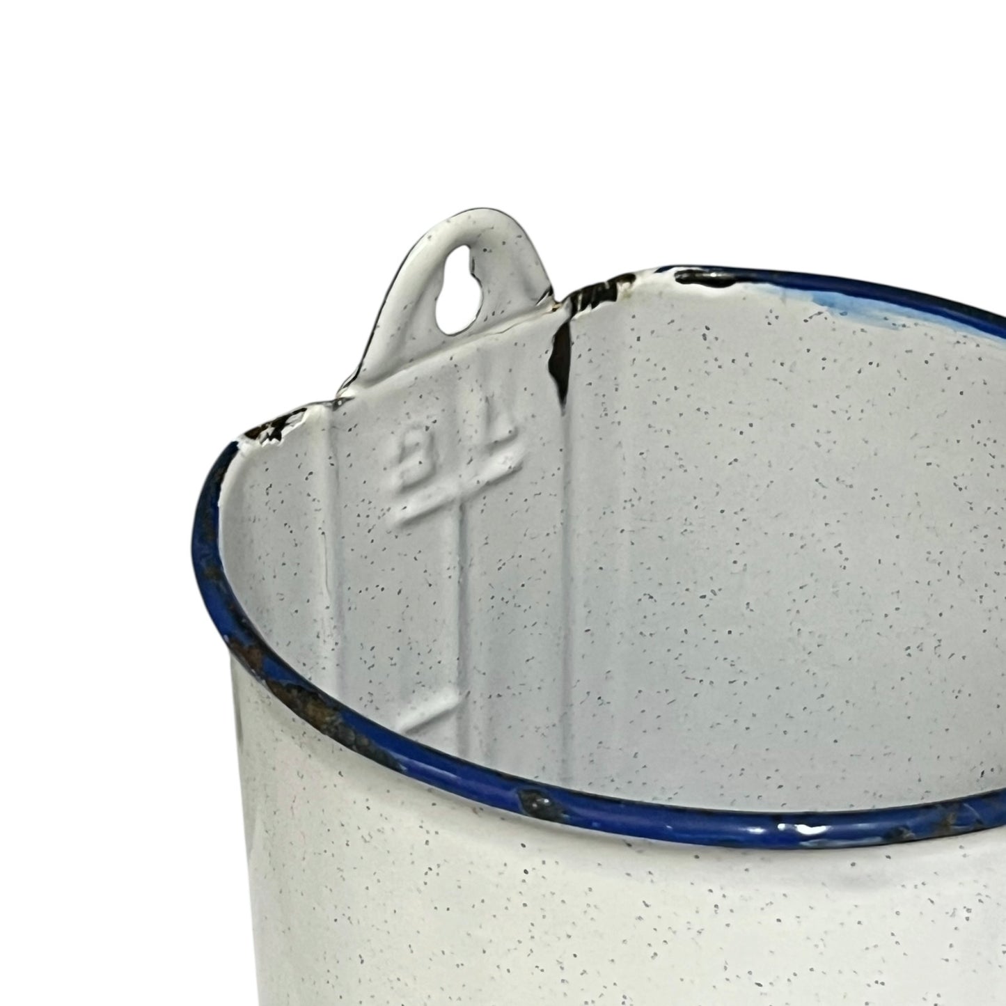 Close-up of a enamel planter with speckled pattern on a white background