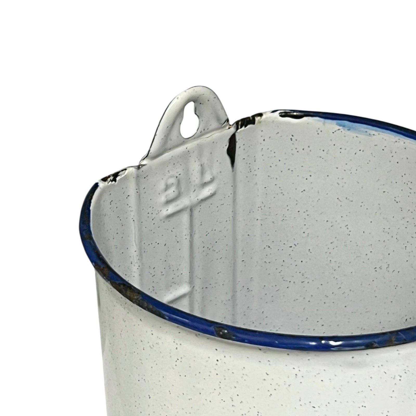 Close-up of a enamel planter with speckled pattern on a white background