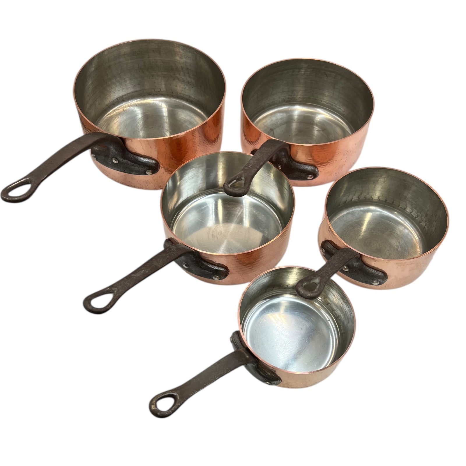 close up of copper pan set