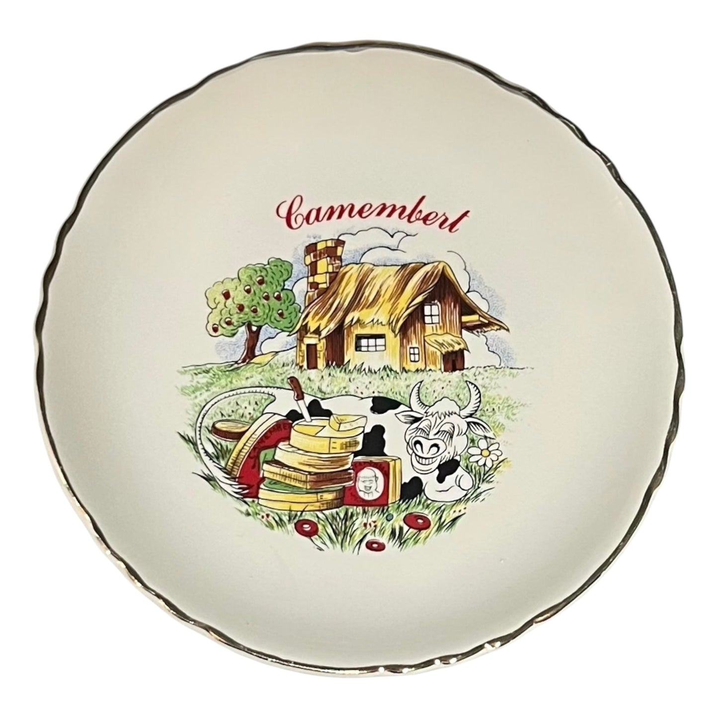 Decorative plate with a cartoon-style illustration of a cheese house, cow, and cheese stack on a white background.