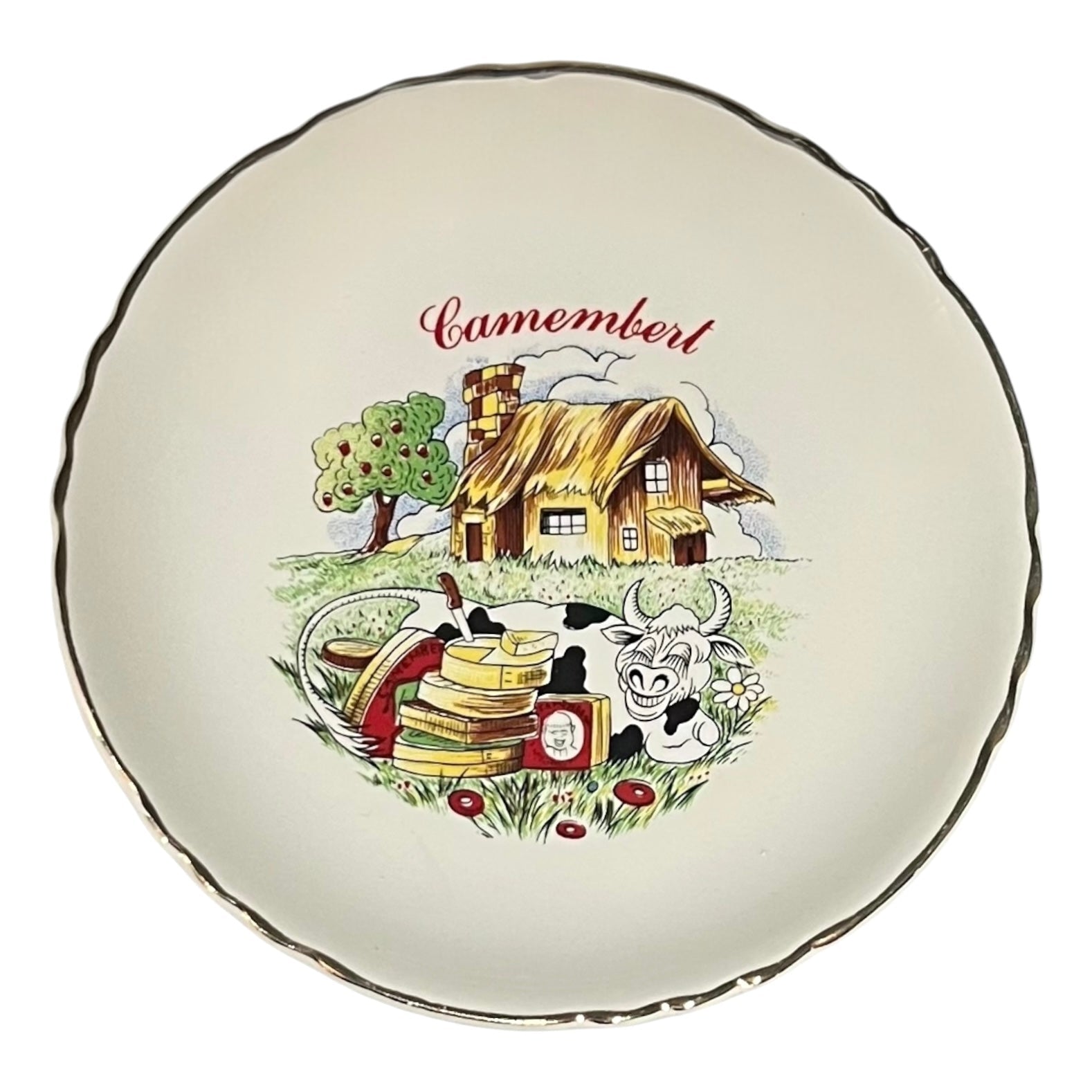 Decorative plate with a cartoon-style illustration of a cheese house, cow, and cheese stack on a white background.