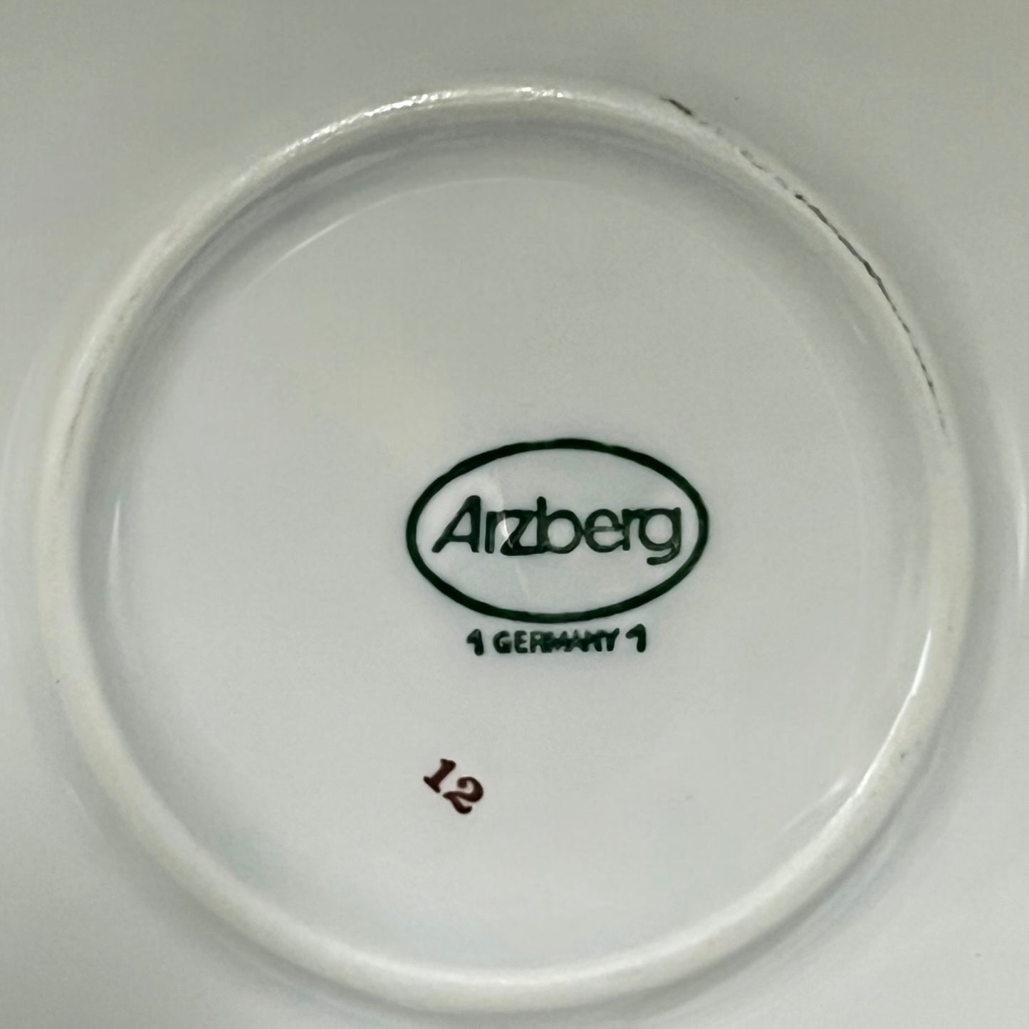 Arzberg logo on a white ceramic plate