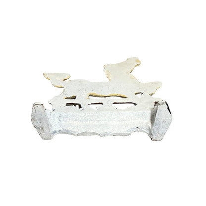 close up of a doorstop on a white background