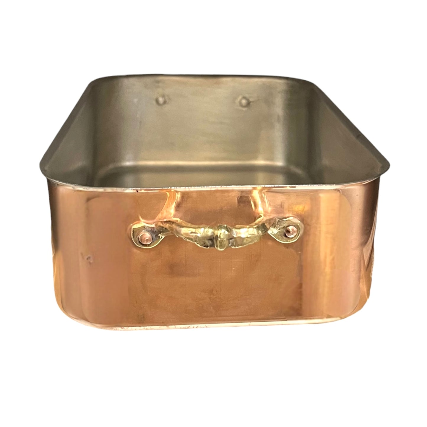 Copper roasting pan with tin lining on a white background