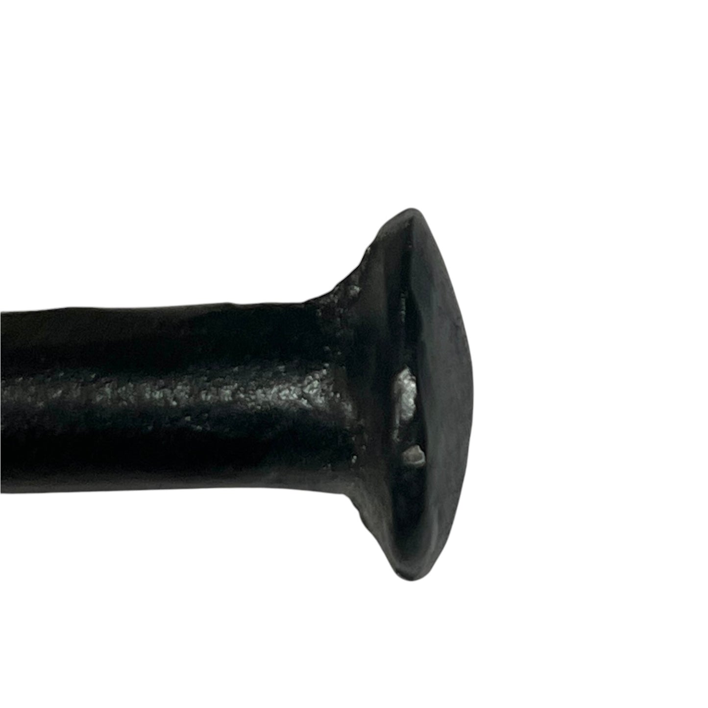 A close-up of a black toilet paper holder
