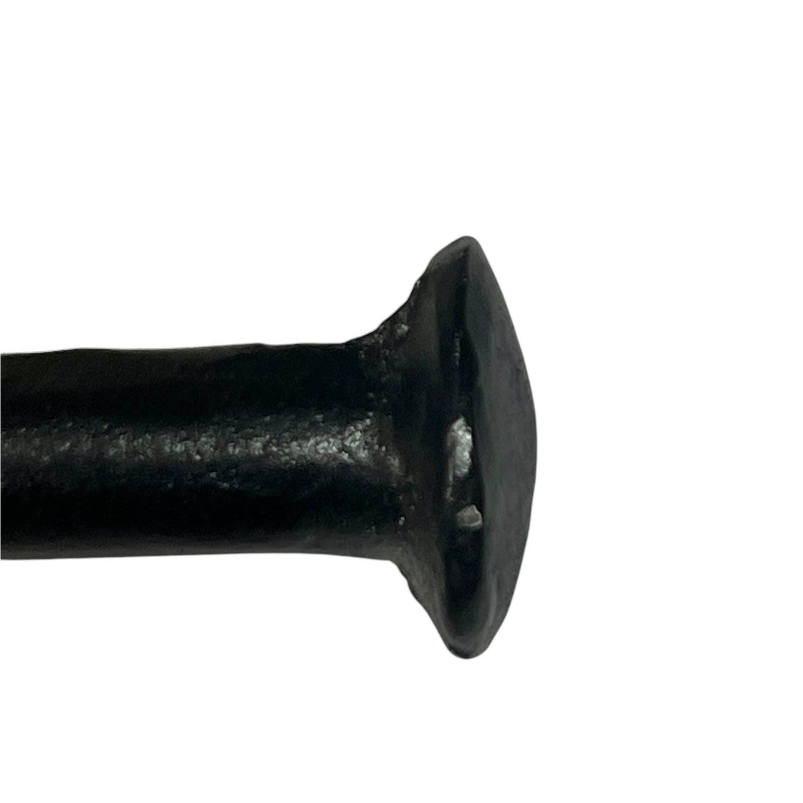 A close-up of a black toilet paper holder