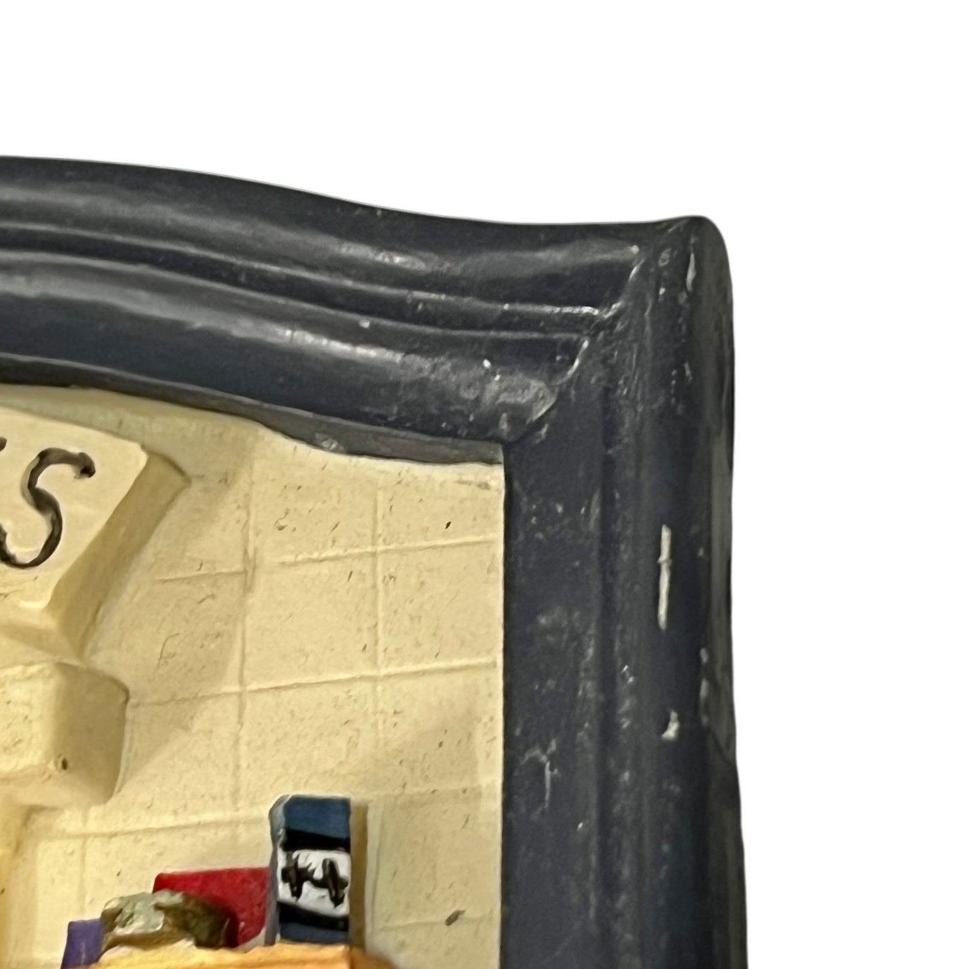 Close-up of a toilet door sign on a white background