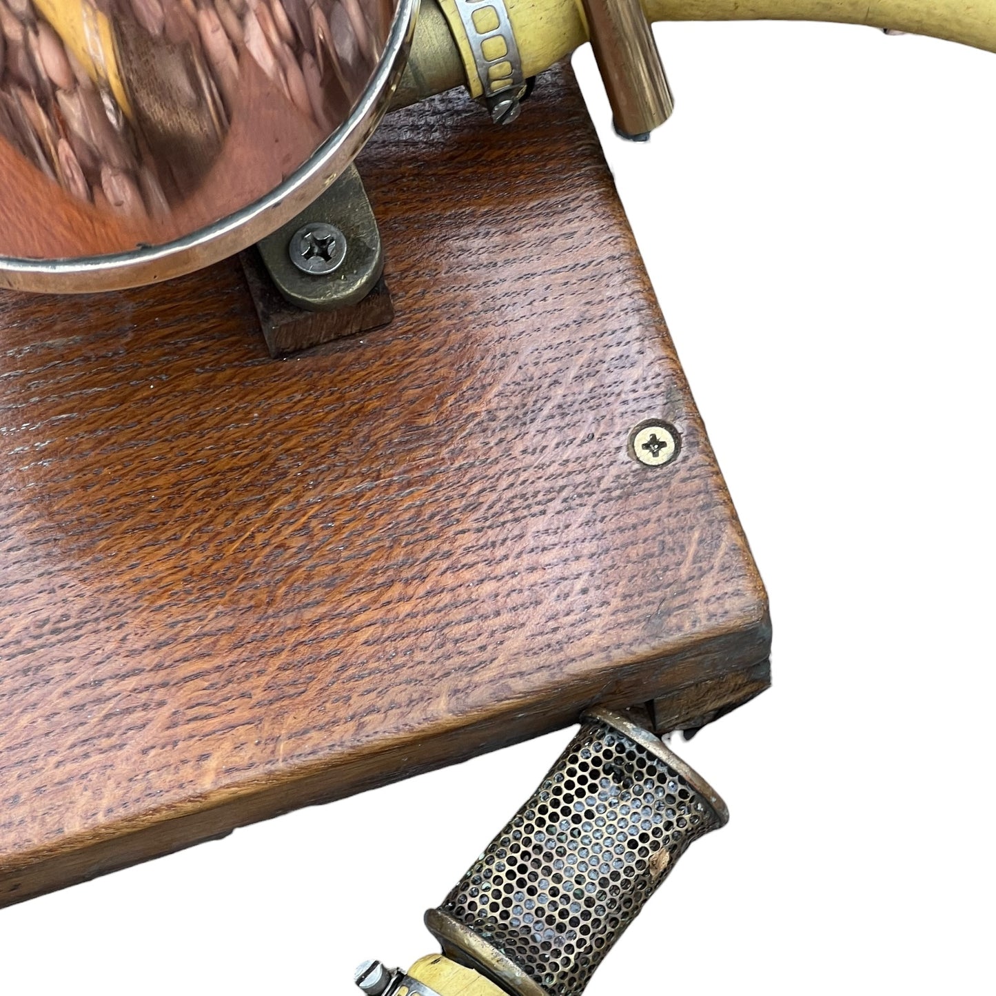 close up of a French copper garden sprayer on a white background 